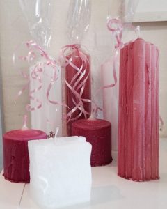 Pillar candles in hot pink with white column candles